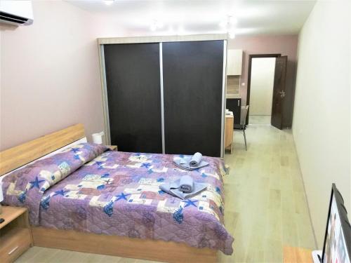 A bed or beds in a room at Studio flat for upto 3 people