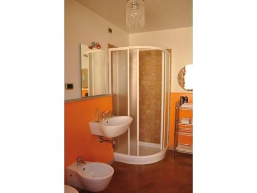 a bathroom with a shower and a sink at Lanita B&B in Càbras