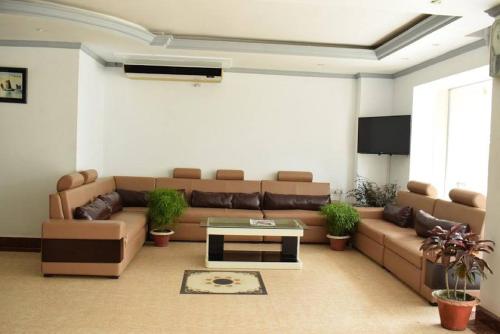 a living room with a couch and a table at Hotel Regal Palace in Cox's Bazar