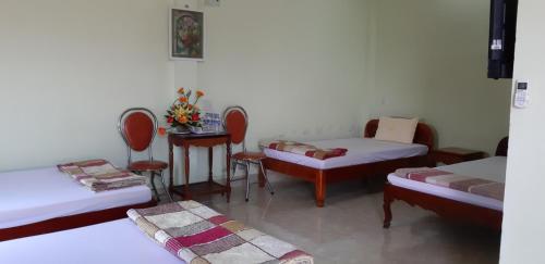 Postel nebo postele na pokoji v ubytování Hai Dang Hotel