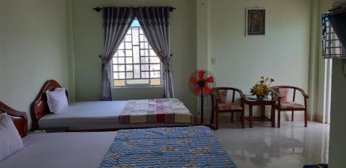 Postel nebo postele na pokoji v ubytování Hai Dang Hotel