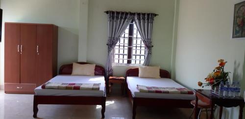 Postel nebo postele na pokoji v ubytování Hai Dang Hotel