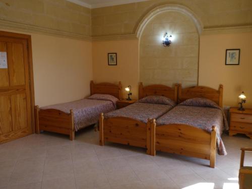 Кровать или кровати в номере San Antonio Guesthouse