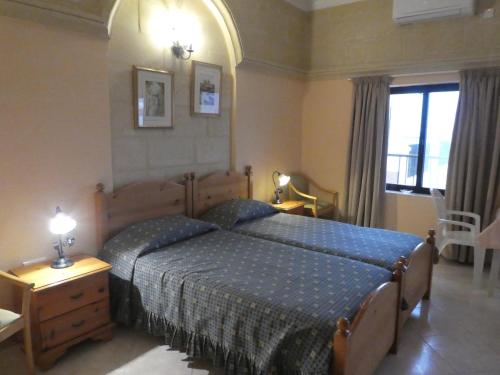 Кровать или кровати в номере San Antonio Guesthouse
