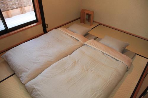 Postel nebo postele na pokoji v ubytování Temari Inn Yukikai