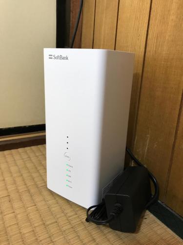 a white box sitting on the floor next to a wall at Guest House OkiniⅡ in Osaka