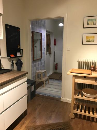 a kitchen with a door leading to a living room at Anki's apartment in Haparanda