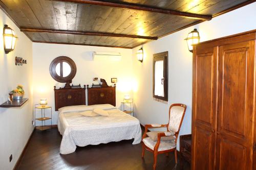 En eller flere senge i et værelse på Casale Maddalena