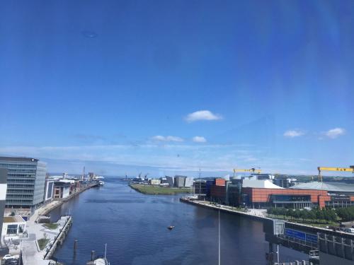 a view of a river with buildings and a city at Luxury 2 Bedroom Apartment in Prime City Location in Belfast