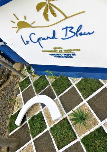 a box with a fake grass and a fake plant at Le Grand Bleu in Andilana
