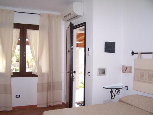 Ένα ή περισσότερα κρεβάτια σε δωμάτιο στο Agriturismo La Rocca Manna