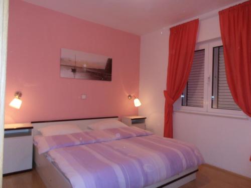 Ένα ή περισσότερα κρεβάτια σε δωμάτιο στο Apartments Stancic