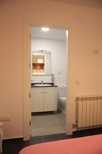 a bathroom with a sink and a toilet at APARTAMENTOS LA VEREDA in Cuenca