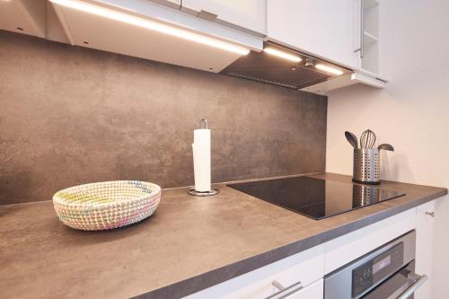 a kitchen with a counter top with a candle on it at Weserdeichblick in Bremerhaven
