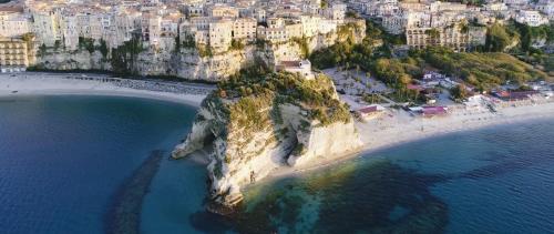 an aerial view of a small island in the ocean at Sunset Tropea in Tropea