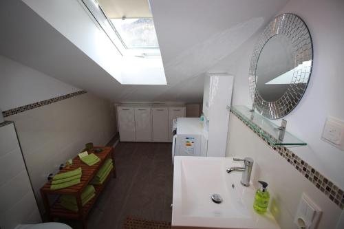 a bathroom with a sink and a mirror at Chalet Heidi in Rottach-Egern