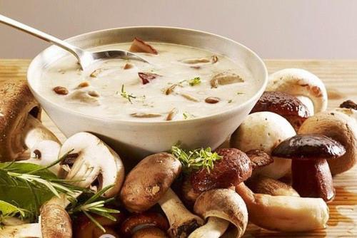 a bowl of soup with mushrooms on a table at Kitica house in Verkhovyna