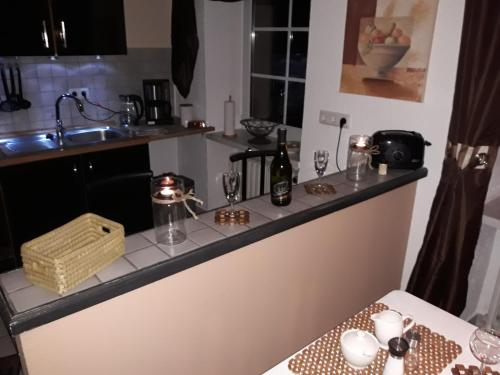 a kitchen with a counter with glasses on it at Ferienhaus Blue in Berlingen