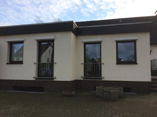 a house with three windows on the side of it at Apartement in Seelze Lohnde in Seelze