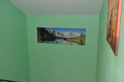 a picture of a mountain on a wall in a room at Apartment Holiday Lungötz in Annaberg im Lammertal