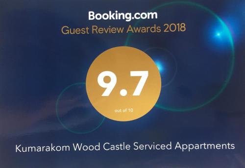 a sign that reads guest review awards kpmg wood castle serviced apartments at Kumarakom Wood Castle Serviced Appartments in Kumarakom