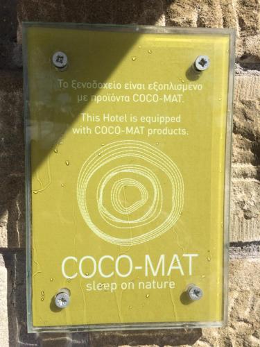 a sign for a coo mat on a wall at Archontiko Tsiboni in Elati Trikalon