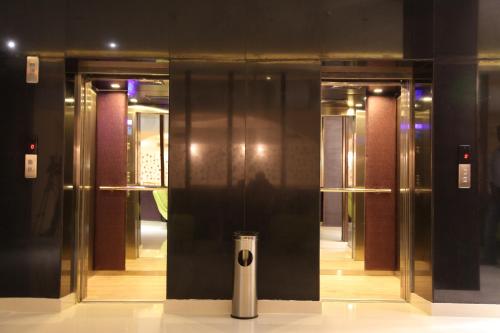 a group of elevator doors in a building at The Purple Leaf Hotels in Hyderabad