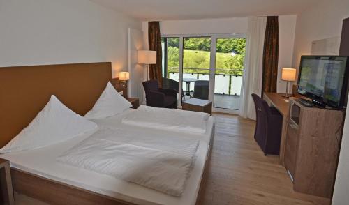 Una cama o camas en una habitación de Hotel Spechtshaardt