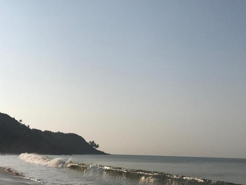 a beach with some waves in the water at All Seasons Guest House in Vasco Da Gama