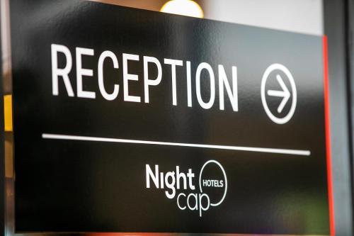 a sign with the words reception on it at Nightcap at Hendon Hotel in Adelaide