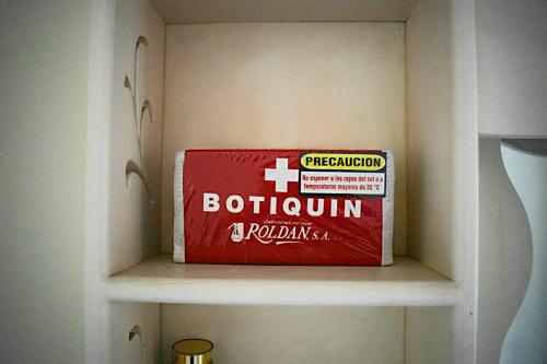 a box sitting on a shelf in a room at A La Dolce Vita Beachfront Hotels, Las Terrenas, Samana in Las Terrenas