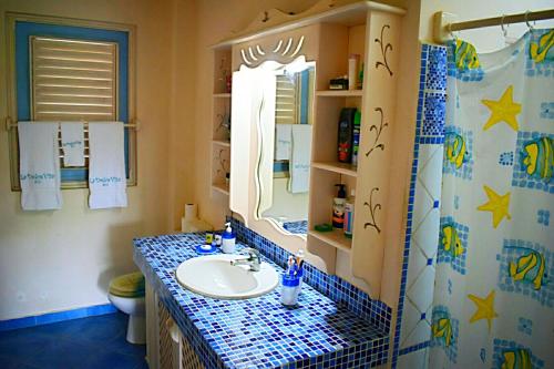 a bathroom with a sink and a mirror at A La Dolce Vita Beachfront Hotels, Las Terrenas, Samana in Las Terrenas