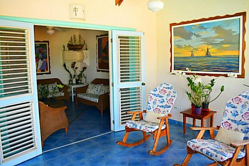 a living room with chairs and a table at A La Dolce Vita Beachfront Hotels, Las Terrenas, Samana in Las Terrenas