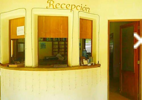 a reception area of a restaurant with a window at A La Dolce Vita Beachfront Hotels, Las Terrenas, Samana in Las Terrenas