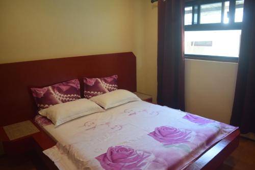En eller flere senge i et værelse på Siargao Sunset Bay Beach Villas