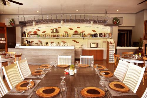 a long table with plates of food on it at Forest Crest Nature Hotel and Resort Powered by ASTON in Nasugbu