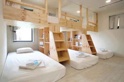 
A bed or beds in a room at Olle Stay
