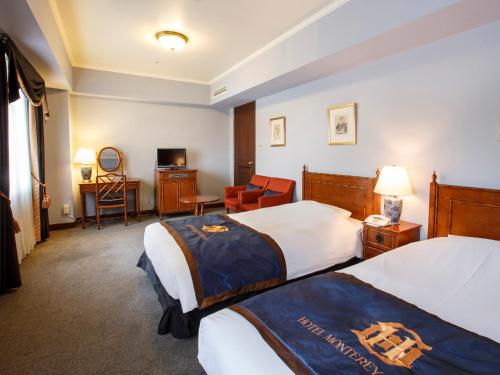 
Tempat tidur dalam kamar di Hotel Monterey Sapporo
