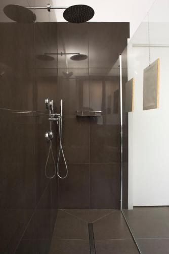 a bathroom with a shower with a glass door at Principessa Mafalda in Messina