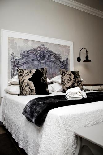 Ένα ή περισσότερα κρεβάτια σε δωμάτιο στο French Karoo Guesthouse