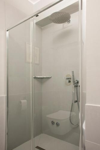 a shower stall with a toilet in a bathroom at Principessa Mafalda in Messina