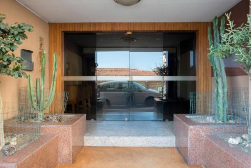a view of a car through a glass door at Principessa Mafalda in Messina