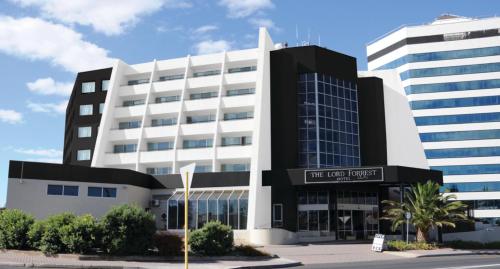 a large white building with a sign in front of it at Best Western Plus Hotel Lord Forrest in Bunbury