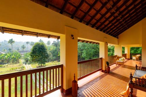 a view from the balcony of a house at Windermere River House in Neriyamangalam