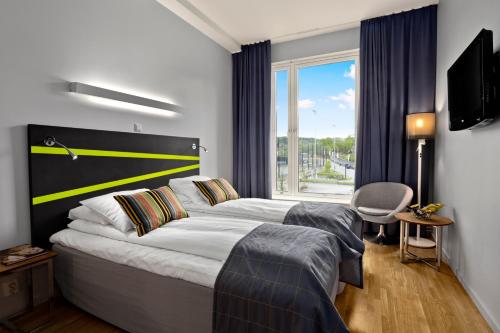 Postel nebo postele na pokoji v ubytování Thon Partner Hotel Ullevaal Stadion