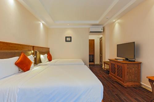 Katil atau katil-katil dalam bilik di Hoang Lan Hotel