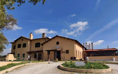 an old building in the middle of a road at Il Casale Di Roma in Prima Porta