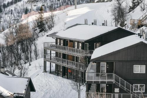 an aerial view of a house in the snow at Skarsnuten Apartments in Hemsedal
