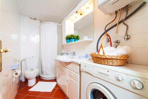 a bathroom with a washing machine and a sink at F & B Summer Collection - Kassandra - Mola Kaliva in Mola Kalyva