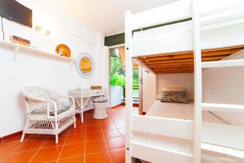 a bedroom with a bunk bed and a desk at F & B Summer Collection - Kassandra - Mola Kaliva in Mola Kalyva